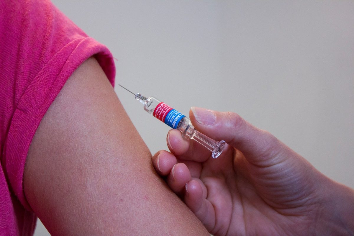 photo showing arm and syringe