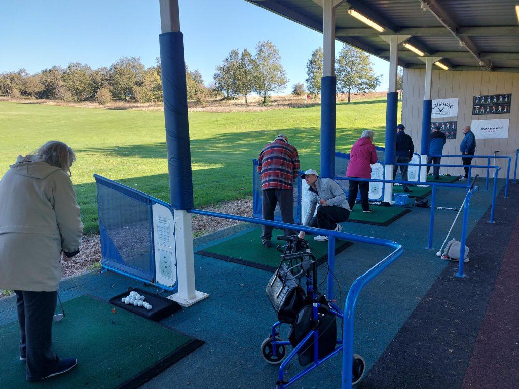 Photo of SSW members at a golf range day out at Worthing Gold Club