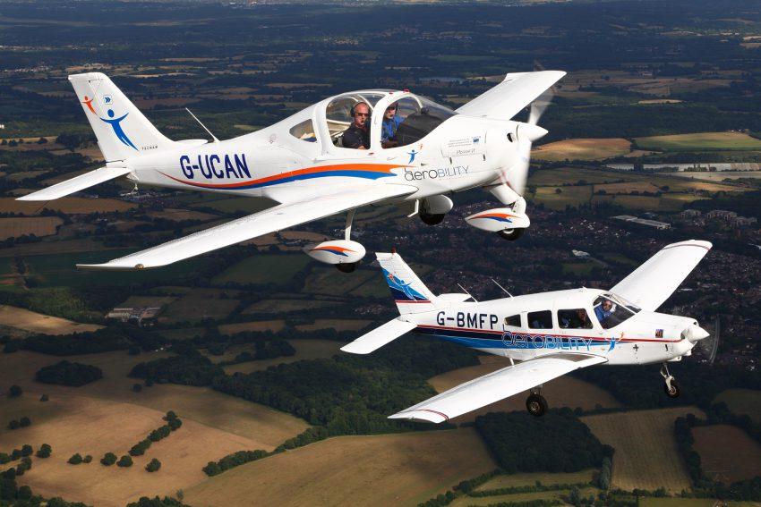 photo of two of the Aerobility airplanes in flight