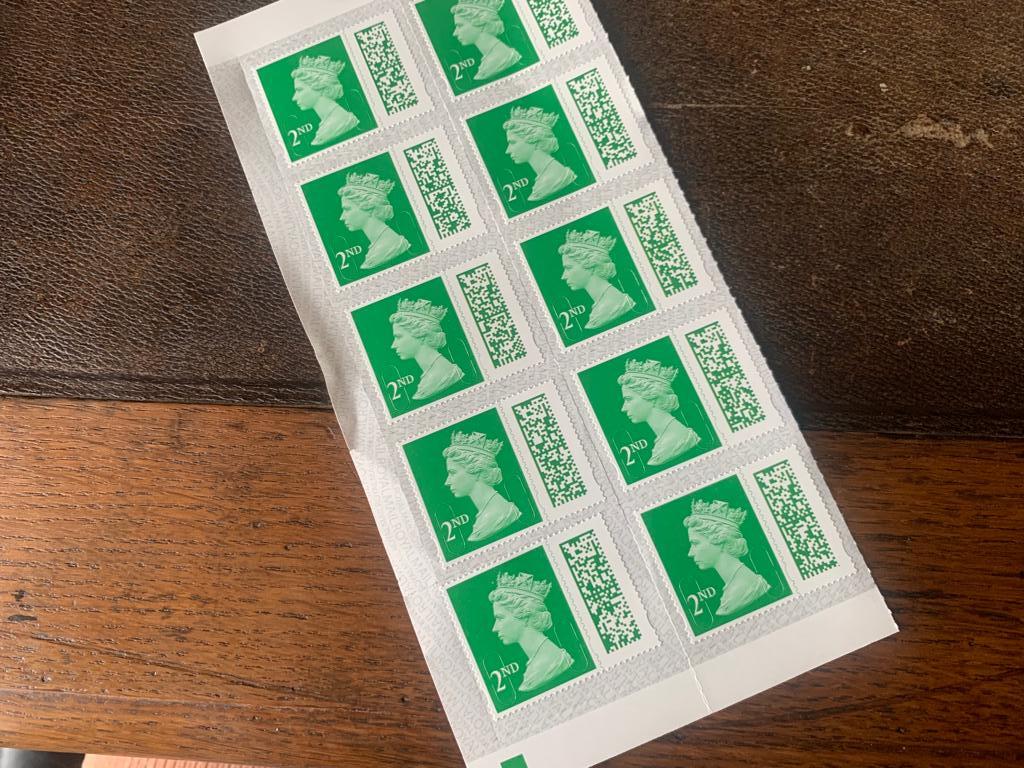 a photo of the new style UK postage stamps with the barcode.