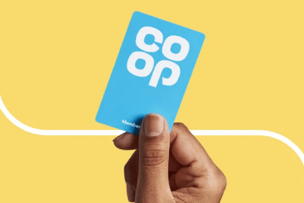 a photo of a hand holding a blue Co-op loyalty type card.