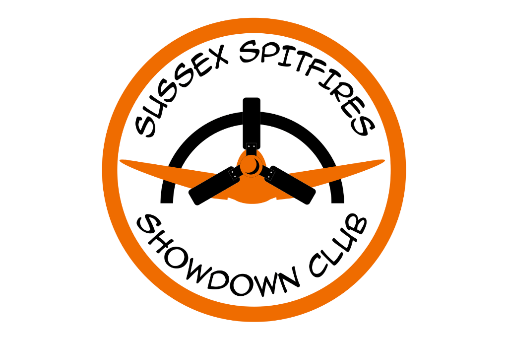 The Logo for the Sussex Spitfires Showdown team. An orange circle with a silhouette of a spitfire inside, surrounded by the words 'Sussex Spitfires Showdown Club'