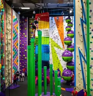 rock climbing walls, with someone climbing up one