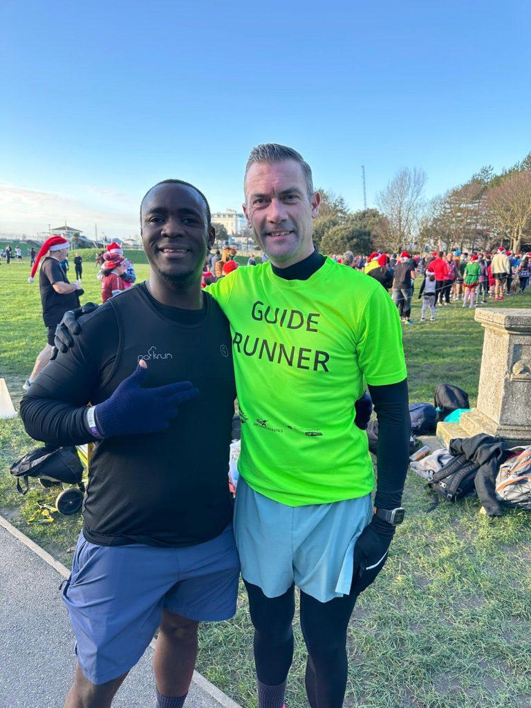 Kombo and Guide Runner Warwick in their running gear at Splashpoint in Worthing.