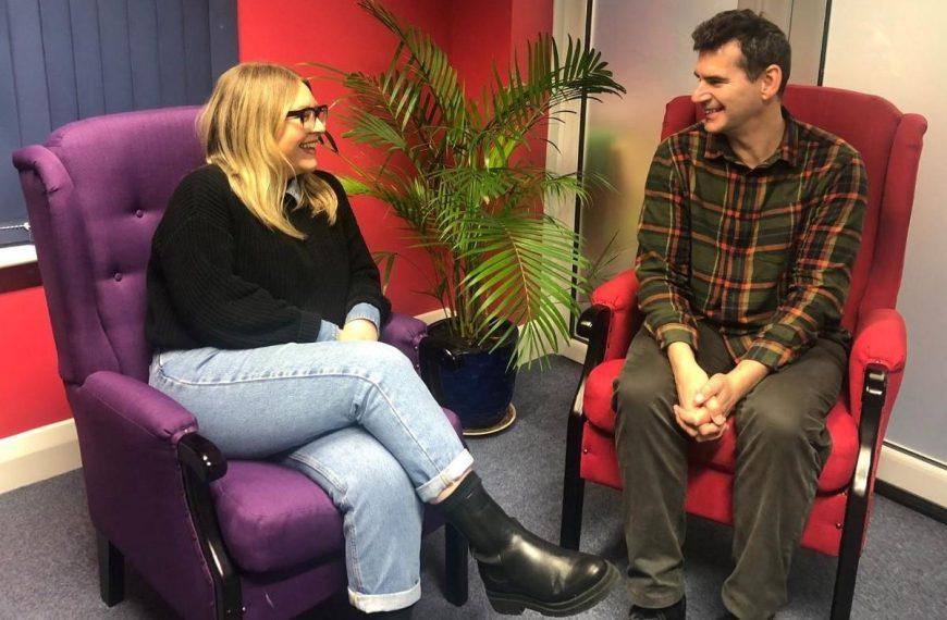 SSW's Kate and David, the wellbeing team, sitting in armchairs and chatting
